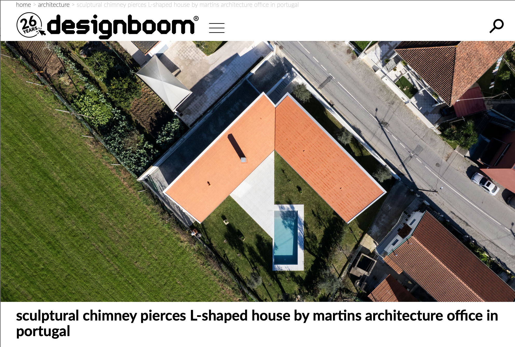 As they said: �sculptural chimney pierces L-shaped house� at designboom.